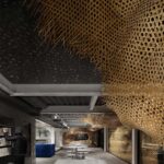 Librería en Shanghái The Arts Bridge Space. Infinity Mind | 03 the traditional weaved bamboo installation which extends from outside through to the ceiling of the interior photo credit infinity mind