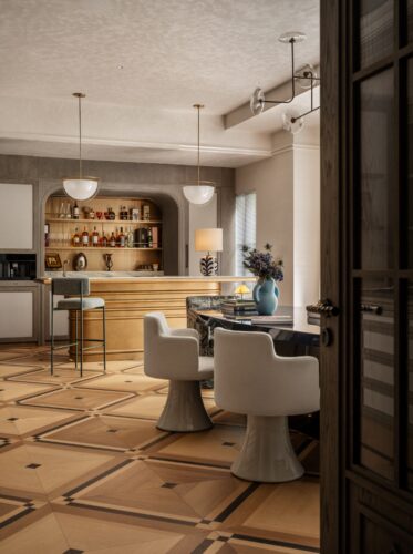 From oil paintings and hand-bound artist books to mixed-media sculptures and contemporary canvases, artworks throughout the residence enter into conversation with furniture, textiles, and lighting through color, subject, and materiality.