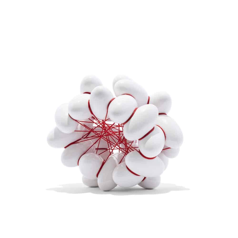 Ellipse 11-2023. White glazed Earthenware with red PVC. H 38 x W 46 x D 35 cm. Artist Steen Ipsen. Photo Jeppe Gudmunsen-Holmgreen.