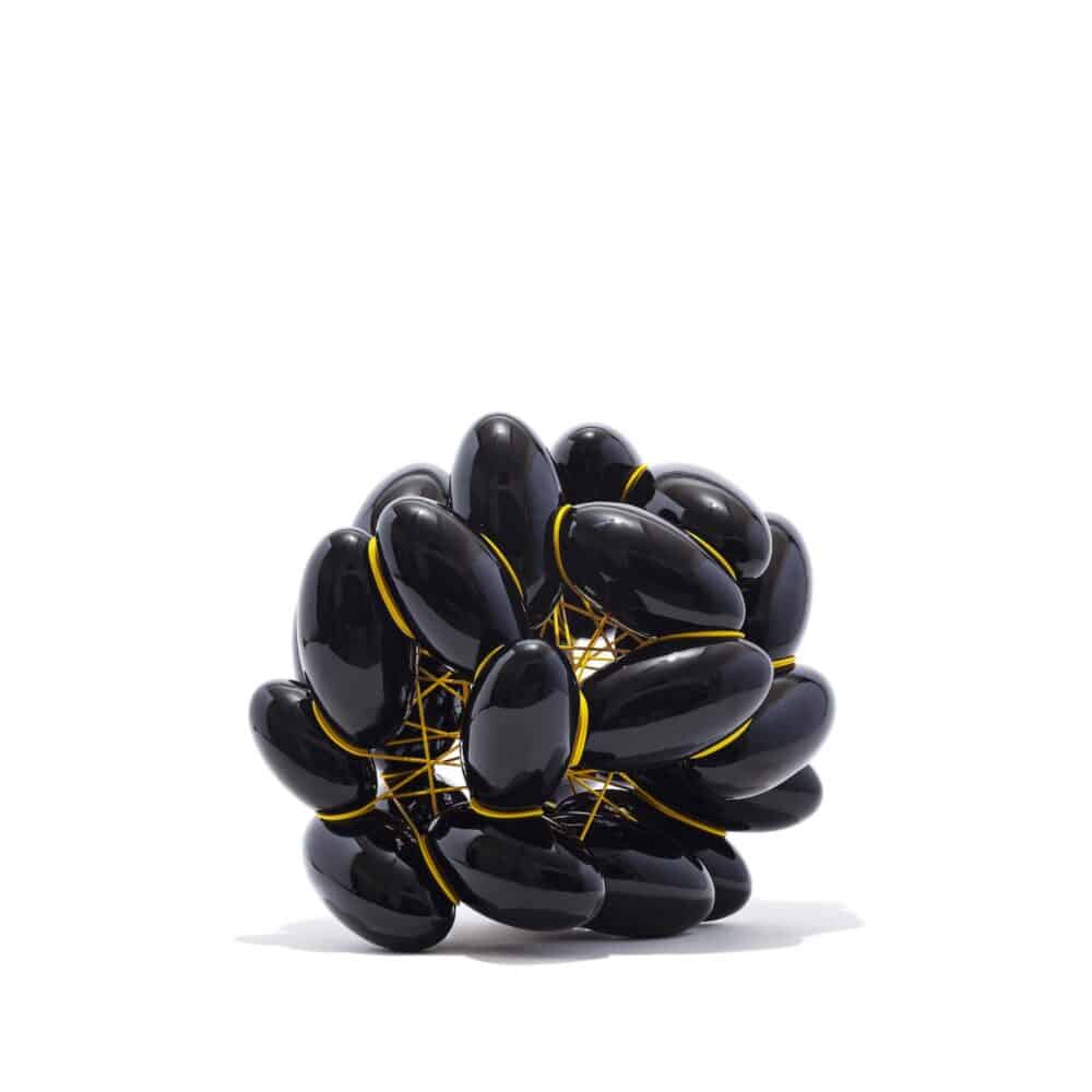 Ellipse 14-2023. Black glazed Earthenware with yellow PVC. H 47 x W 50 x D 43 cm. Artist Steen Ipsen. Photo Jeppe Gudmunsen-Holmgreen.